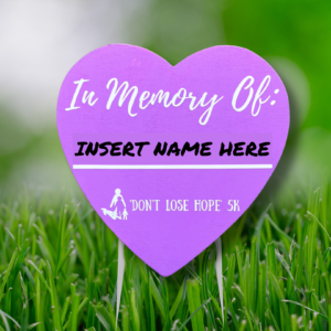 Purple heart shaped In Memory Of lawn sign.
